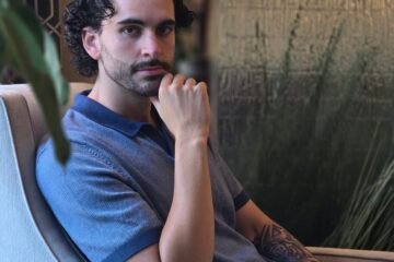 Nick Gallardo, Director of Business Affairs at Neyius Hotel Group, seated in a hotel lounge